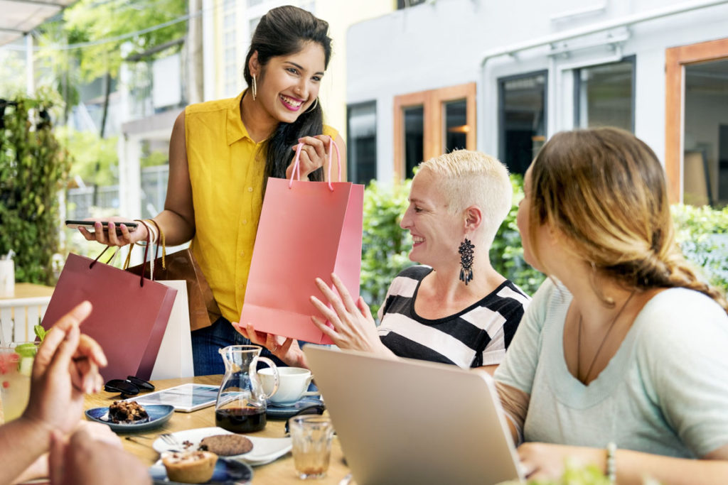 young women enjoying treat after shopping
